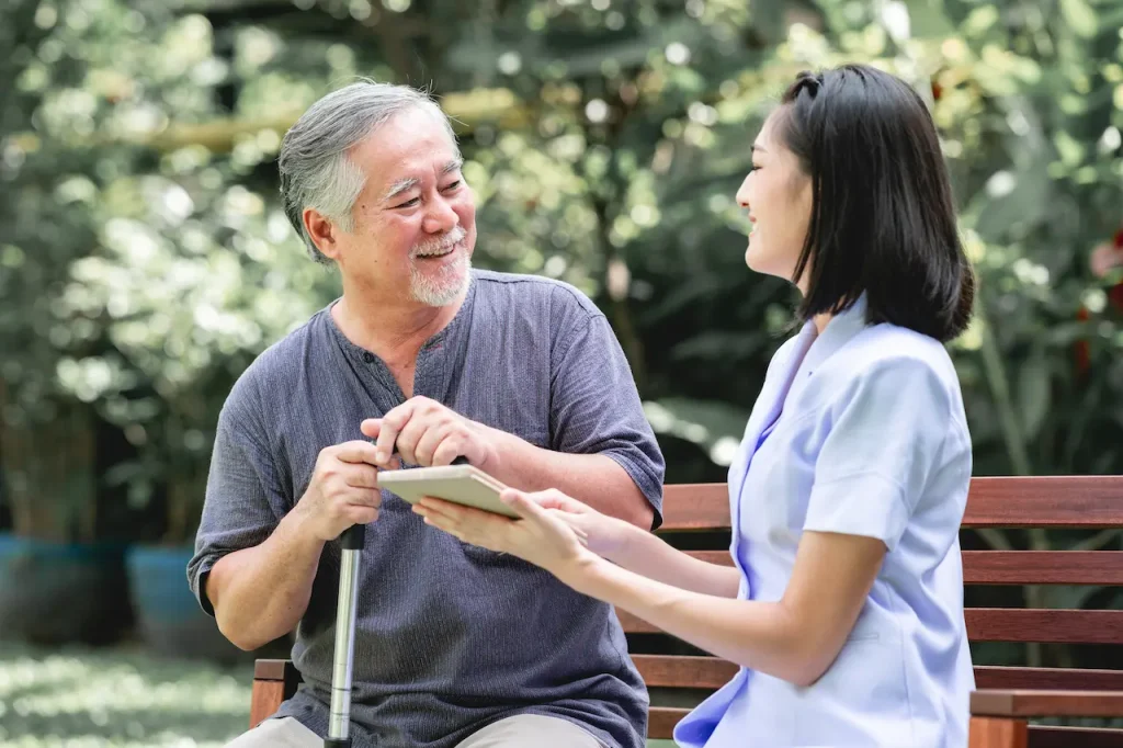 Two people sitting on a bench